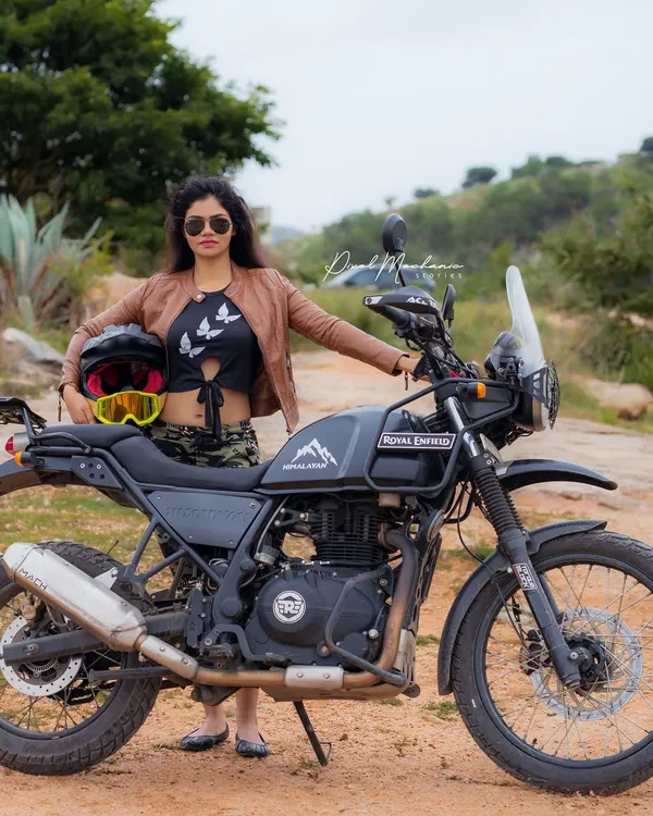 Ready for an adventure. This shot combines a love for biking with a strong, confident pose, creating a powerful lifestyle portrait for the modern adventurer.