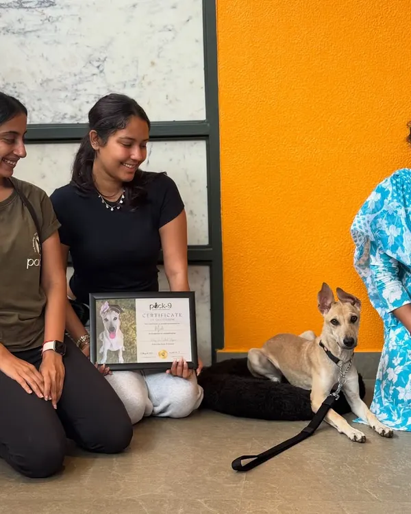 Celebrating Mooli's graduation day! Here she is with her loving family and her well-earned training certificate.