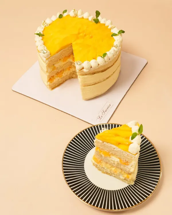 My Mango Vanilla Cream Cake is a true taste of summer. It features layers of light sponge, fresh mango puree, and vanilla cream, topped with more juicy mango.