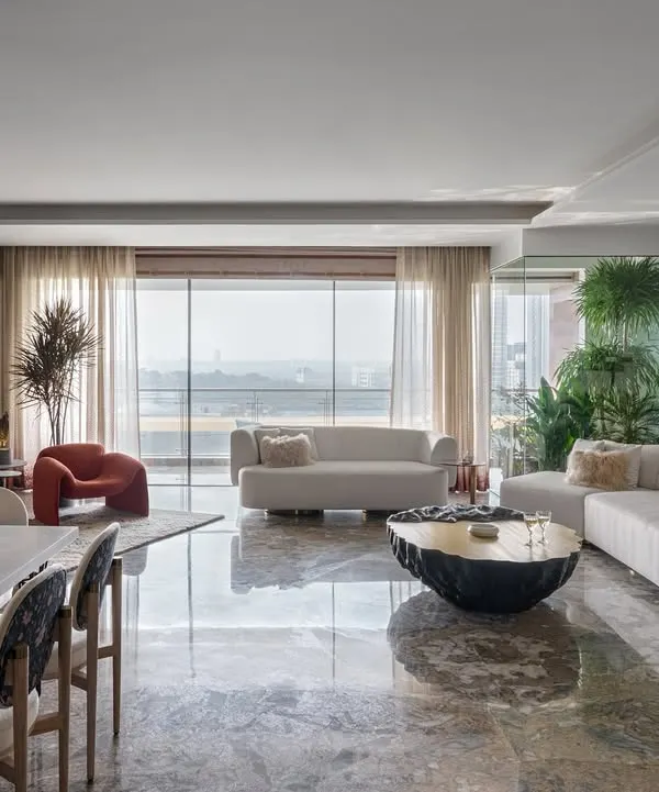 Natural light is one of my favorite materials. In this award-winning Mumbai apartment, I created an all-white living space that feels both serene and expansive, with clean lines and an open layout that draws the outdoors in.