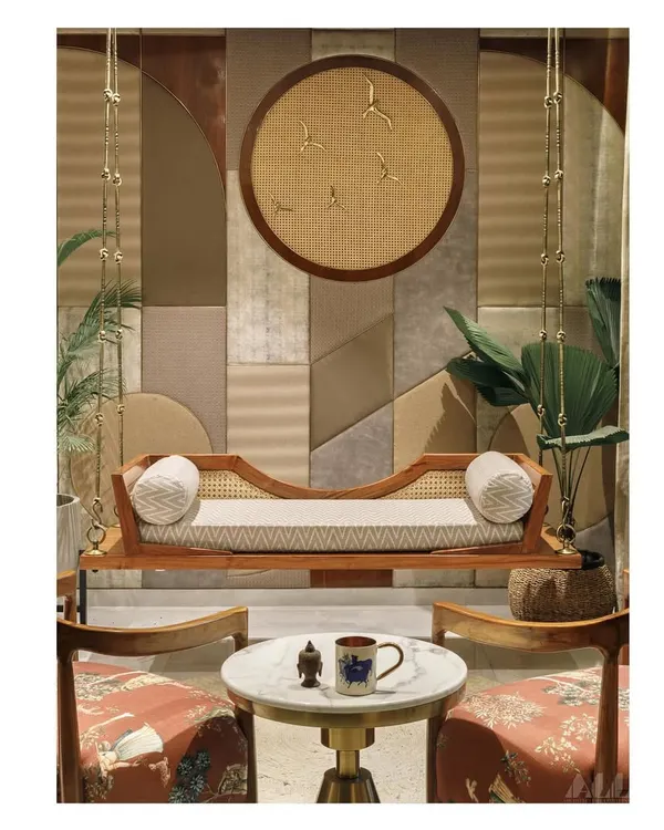We designed this informal living area as a playful, welcoming space. The centerpiece is a contemporary wooden jhula, set against a bespoke, puzzle-like wall of mixed textures, creating a perfect spot to relax and entertain.