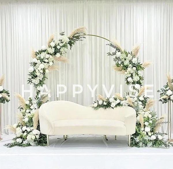This elegant and modern stage design, featuring a white floral arch with pampas grass, is perfect for a chic engagement or reception. It shows how I blend contemporary style with timeless romance.