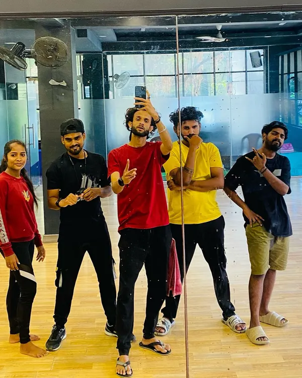 The RDI trainer team striking a pose in the mirror. We are the choreographers and artists ready to guide you on your dance journey.