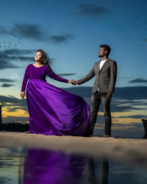 I love how this purple velvet and satin gown looks against the sunset. It's a perfect choice for a romantic pre-wedding shoot, offering a rich color and a fabric that catches the light beautifully.