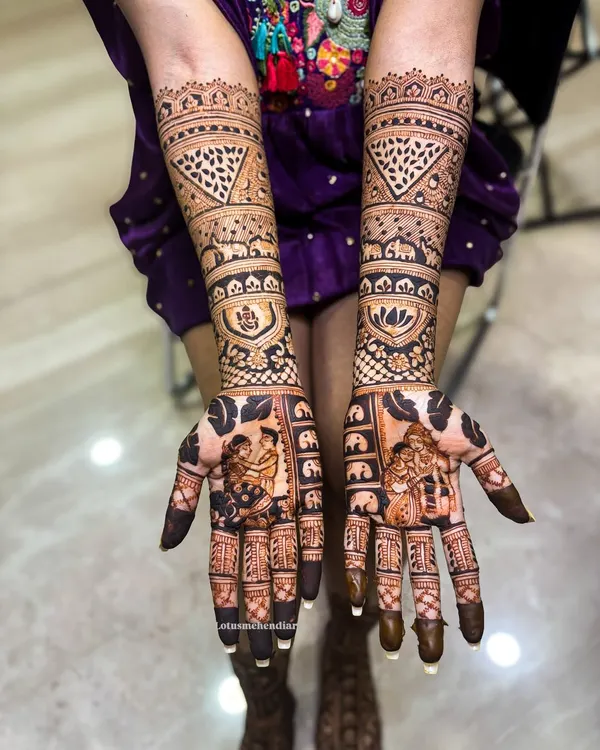 This custom bridal mehendi tells a story with detailed portraits of the bride and groom, a signature service I offer to make your day truly personal. It's a piece of art you can wear.
