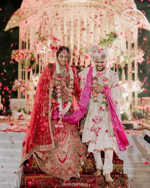 A grand exit showered in petals. We capture the magnificent scale and joyous atmosphere of North Indian wedding celebrations.