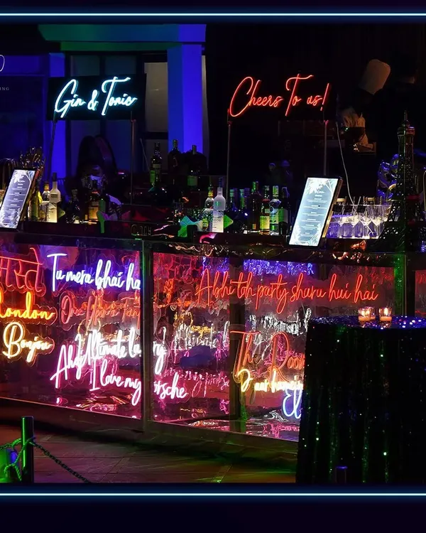 The bar for this neon-themed party was a work of art. I designed it with custom neon signs featuring fun and personal phrases, creating a vibrant and interactive centerpiece for the celebration.