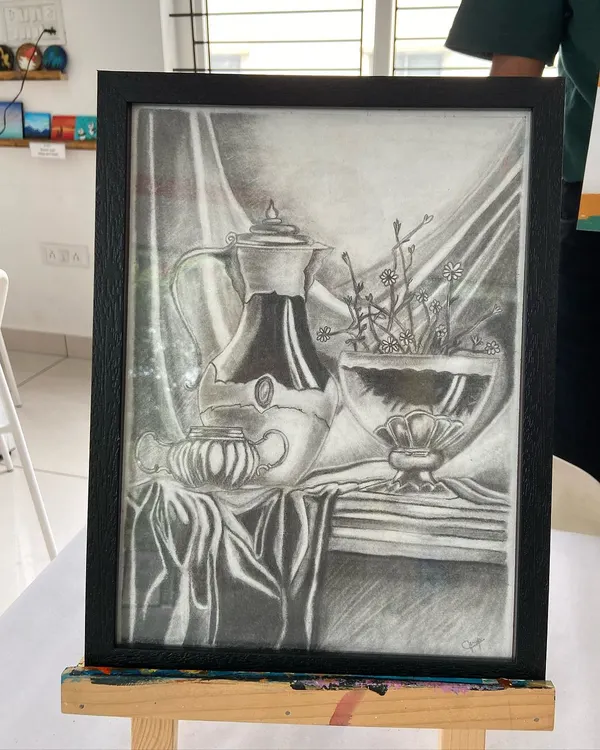 A stunning still life sketch created by a student in our short-term course. Notice the incredible detail in the reflections and fabric folds.