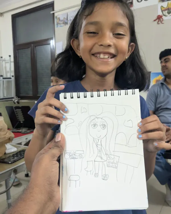 This is what we love to see. One of our youngest, Naomika, drew this in her sketchbook and named it 'best student'. Her dedication to practicing art at this age is truly inspiring.