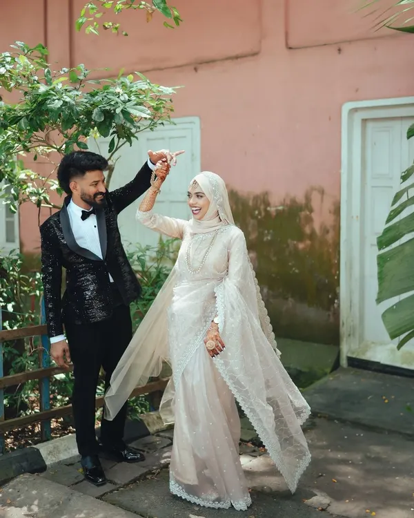 A spontaneous dance in the middle of the street. These are the moments that truly show a couple's personality and love. This was captured during a beautiful Muslim wedding in Kerala.
