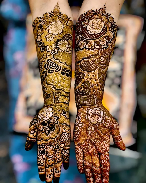 This full-arm bridal henna is what I am most passionate about. Notice the combination of delicate rose motifs, intricate netting, and bold shading to create a design that is both traditional and stunningly modern.