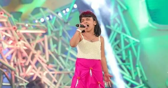 This is me at nine years old, performing on the Super Singer Junior stage. That year-long journey taught me so much about different genres, performing under pressure, and connecting with an audience through television.