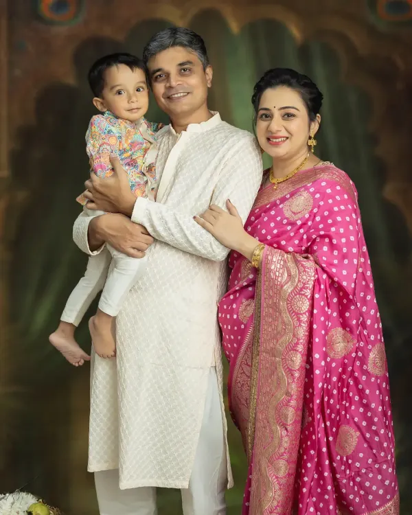 A beautiful family portrait, celebrating the journey to becoming a family of four. Capturing the bond between parents and their first child before the new baby arrives is always a special moment.