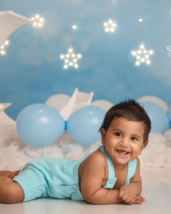 Over the moon for this little star! A six-month sitter session is the perfect time to capture those emerging personalities and adorable, gummy smiles.