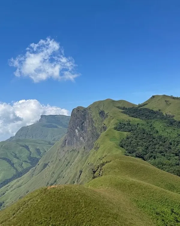 The iconic "knife-edge" ridge of Netravathi Peak on a clear day. This view is what makes the entire climb an unforgettable adventure.