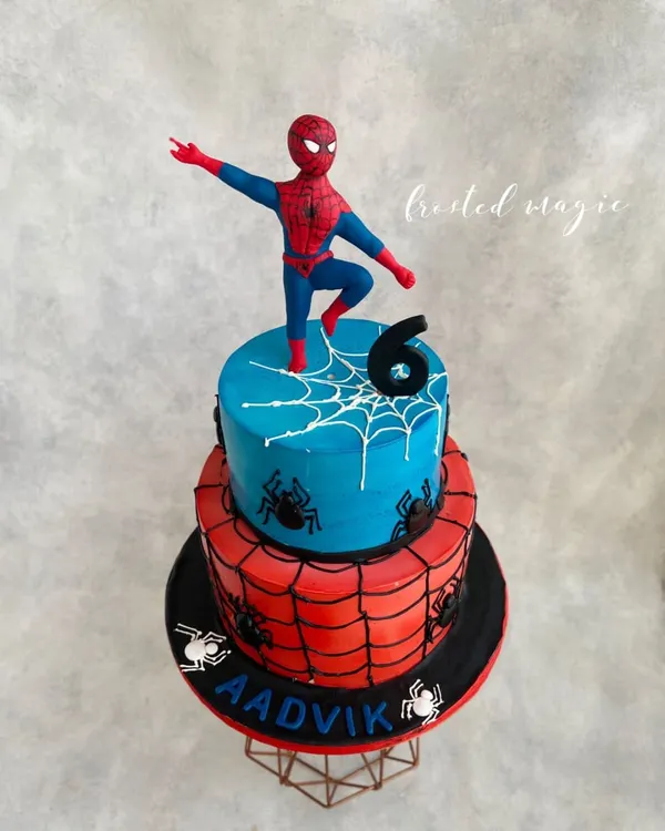 It's your friendly neighborhood Spider-Man! This two-tiered cake features a hand-sculpted Spidey ready for action. The design combines the classic red and blue with spiderweb details for a cake that any Marvel fan would love.