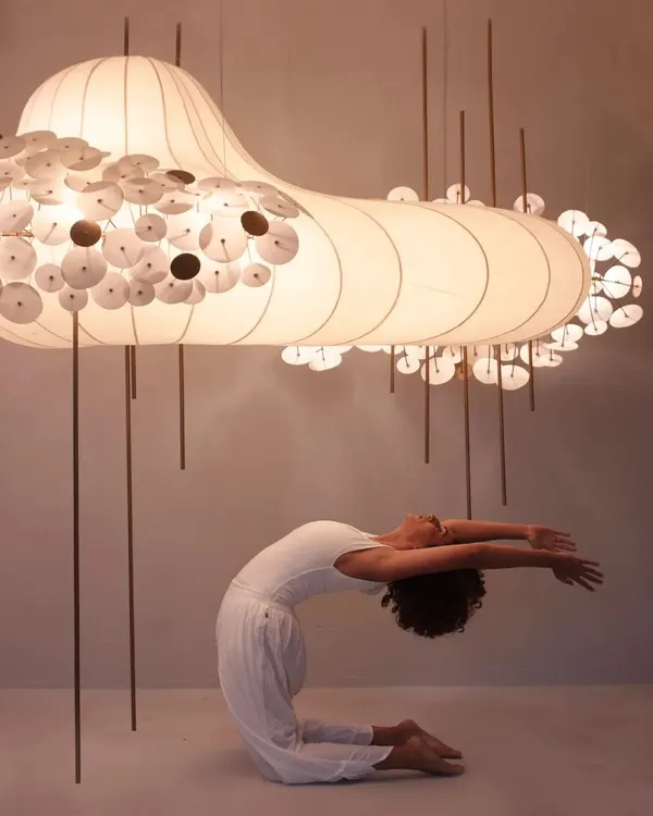 A kneeling backbend, Ustrasana, during a creative photoshoot. The soft lighting and the incredible art piece created such a magical atmosphere for practice.