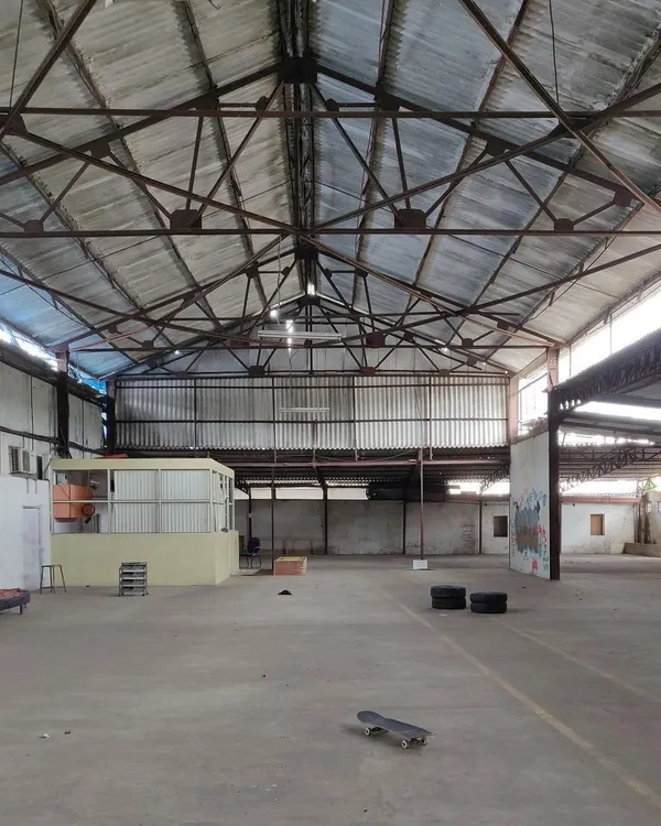 A stark "before" picture of the empty, cavernous warehouse before our transformation began, showing the raw potential of the space.