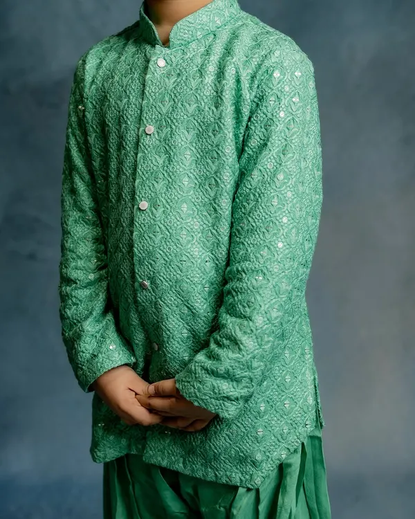 A detailed shot of the mint green Patiala kurta. The fabric's unique weave adds a subtle elegance to this comfortable and easy-to-wear festive outfit.
