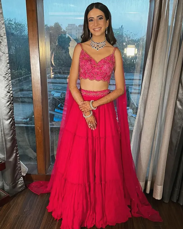 A full-length shot of Rhea's gorgeous engagement outfit. The tiered fuchsia skirt creates beautiful movement, while the intricately embroidered blouse adds a touch of sparkle.