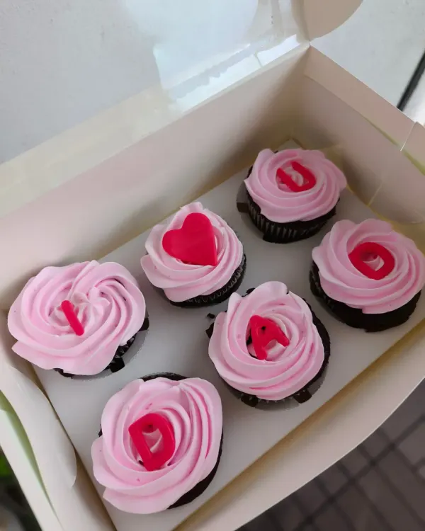 My "I ❤️ DAD" cupcakes are a popular Father's Day gift. This box of six chocolate cupcakes is topped with pink frosting and the special message spelled out.