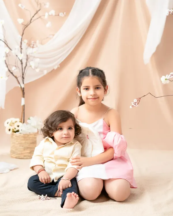 A sweet portrait of a big sister with her baby brother. Capturing the special bond between siblings is one of the most rewarding parts of my job.