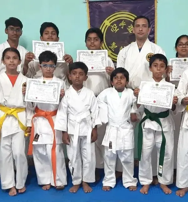 A group of my younger students proudly displaying their new rank certificates. Each certificate is a testament to their focus, discipline, and the effort they have put into their martial arts journey.