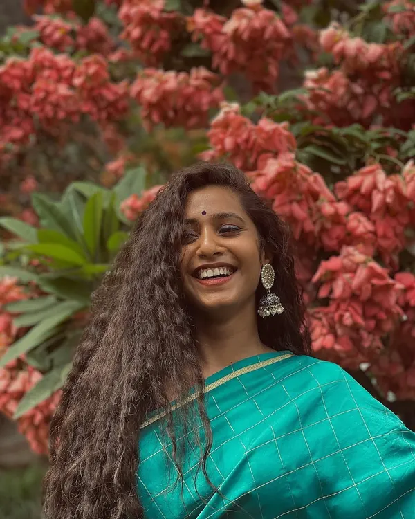 A happy moment captured during a photoshoot. The joy that music brings often just spills over into a smile.