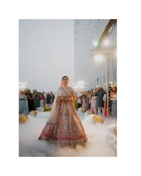 The ultimate bridal entrance. Walking through a cloud of fog, this bride looks ethereal and absolutely stunning. A true hero shot.