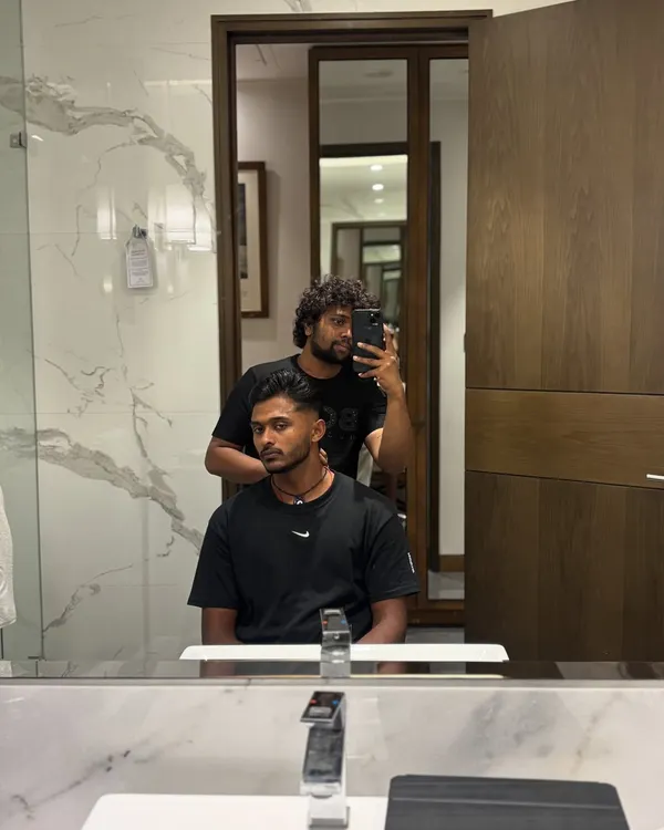 A typical pre-event haircut session with Sai Sudharsan in his hotel room. My mobile grooming setup allows me to provide a full-service experience anywhere.