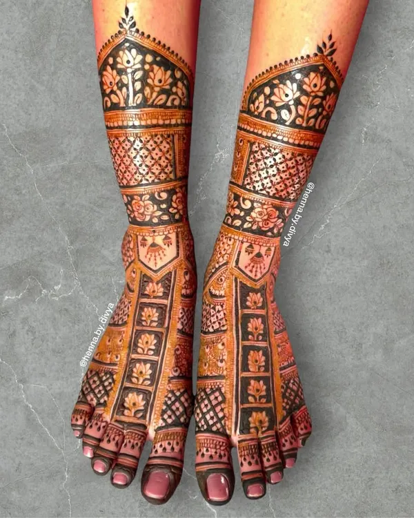 A full-coverage bridal feet design that is both intricate and bold. The design features panels of floral motifs and dense checkerboard patterns, extending up the ankle.