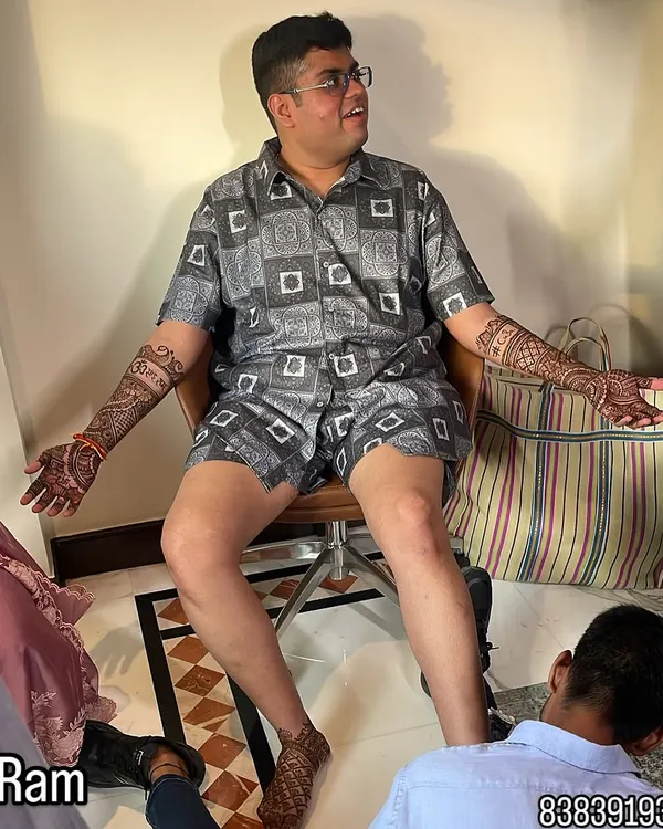 This is what I mean by going all out for your wedding. This groom wanted full coverage, and we designed intricate patterns for both his arms and feet. It’s a bold look that tells a story.