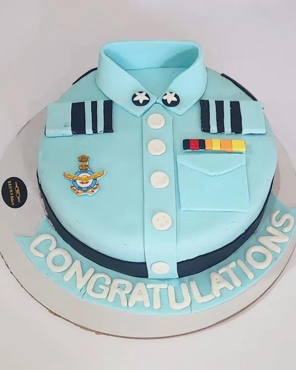 A special cake for a special achievement. We created this Air Force uniform cake to congratulate our client. This is a Belgian chocolate truffle cake with detailed fondant work.
