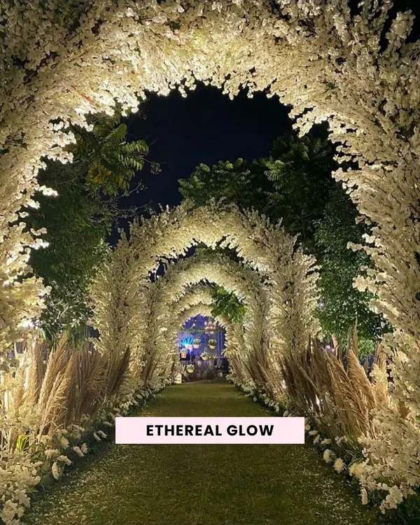 We design enchanting pathways that transport your guests into a world of magic. This ethereal tunnel of glowing baby's breath and pampas grass creates an unforgettable entrance for any luxury wedding or gala.
