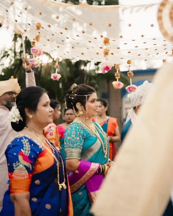 A candid moment from Ankita's wedding day. This unedited DSLR click captures her serene bridal glow, with makeup designed to look flawless both in person and in professional photos.