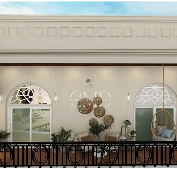 This bohemian-inspired balcony for a Noida penthouse is a tranquil retreat, featuring cane furniture, a rattan swing chair, and lush wall planters.