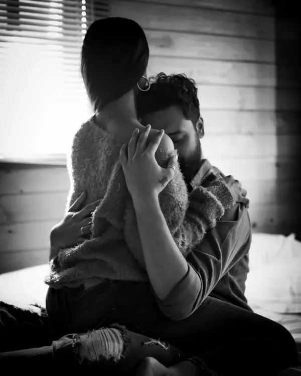 This is what love feels like. A quiet, unguarded moment captured in timeless black and white, focusing purely on the connection between two people.