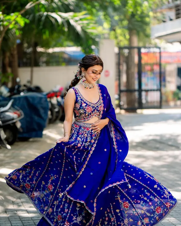 This is what it's all about. A happy client looking absolutely radiant and having the time of her life in my rented royal blue lehenga. This picture is pure joy.