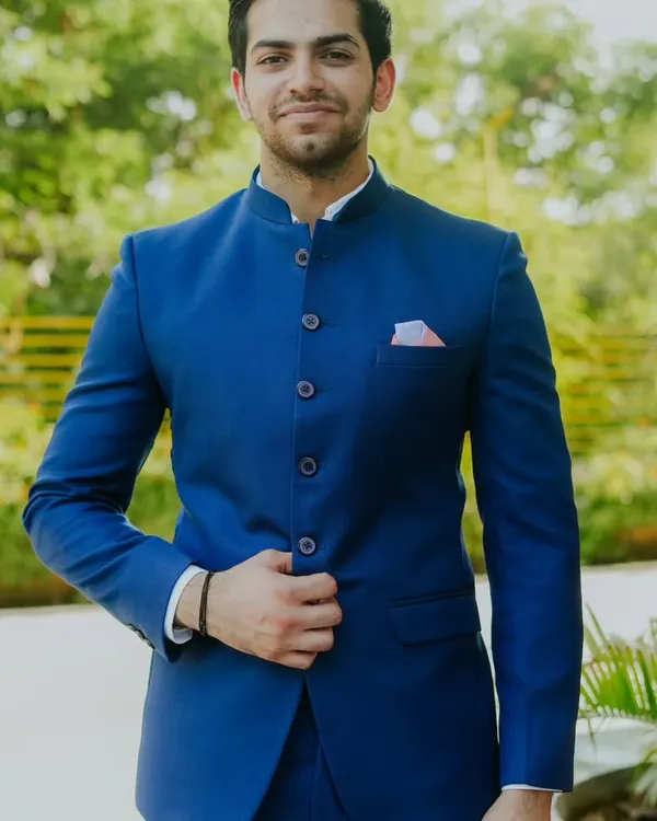 A customer looking sharp in our classic royal blue Jodhpuri suit. The clean lines, bandhgala collar, and perfect fit make it a timeless choice for any formal Indian occasion.