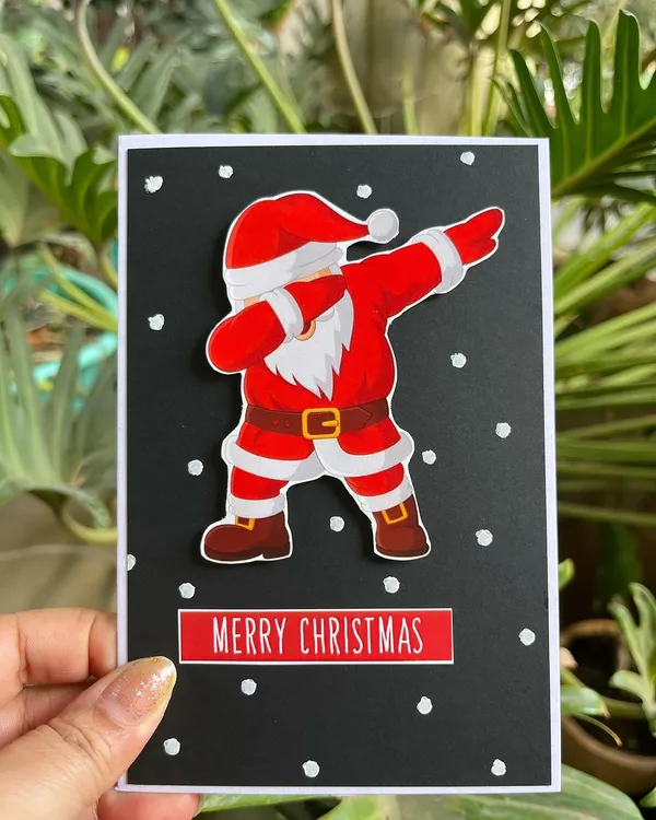 Embrace the holiday season with my handmade Christmas cards! This one features a fun, dabbing Santa to bring a smile to anyone's face.