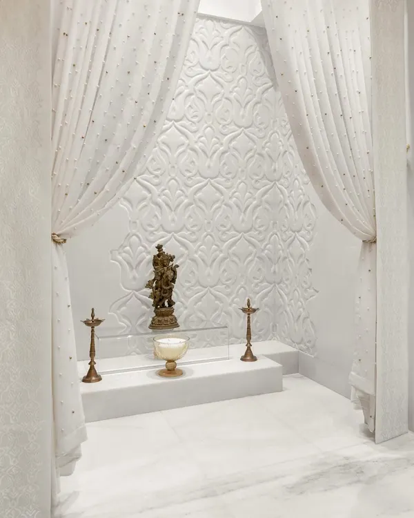 A sanctuary of serenity and faith. Adorned with delicate carvings and draped in billowing white curtains, this sacred space exudes a sense of calm. It’s a haven where worries dissolve and peace reigns supreme.
