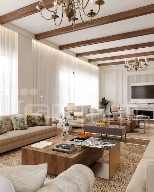 I designed this living space with a wooden beam ceiling and soft neutral tones to exude warmth and sophistication. The grand chandeliers and classic marble fireplace anchor the room, creating a perfect blend of luxury and comfort for gatherings.