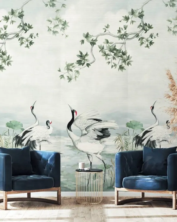 A serene scene unfolds in this design from the Daisy Bennett collection, where graceful cranes are depicted against a soft, watercolor-like background. Paired with deep blue velvet armchairs, the mural brings a soft, luminous poetry to the space.