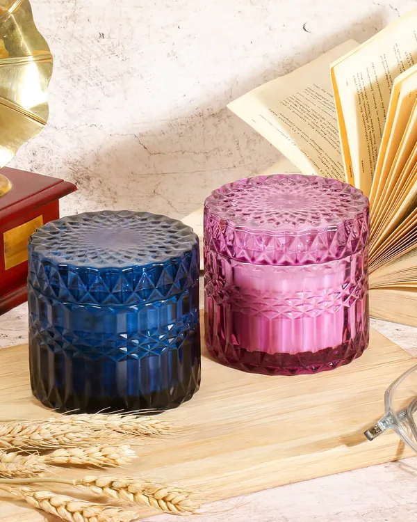A vintage and academic inspired setting for these decorative jar candles. The old books and gramophone create a cozy, studious atmosphere, suggesting these candles are perfect for a reading nook or study.