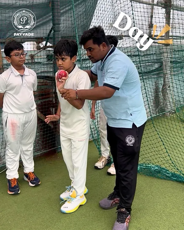 The foundation of great cricket is a perfect technique. Here, one of our coaches provides personalized guidance to a young bowler, carefully adjusting his grip on the ball to ensure the correct seam position for effective spin. This hands-on approach is central to our guru-shishya coaching philosophy.