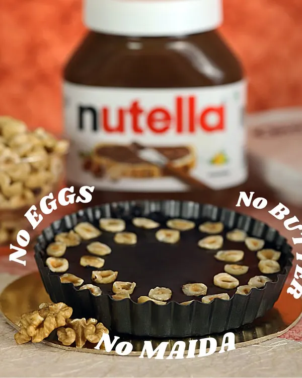 This Nutty Nutella Hazelnut Tart is one of my bestsellers, and it perfectly captures what my baking is all about. It’s rich, delicious, and made completely without eggs, butter, or maida, so you can enjoy it without any guilt.
