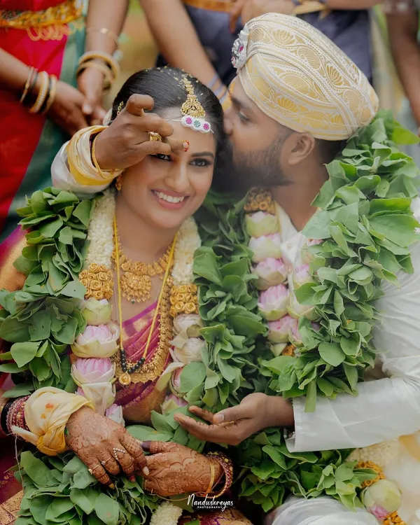 A tender moment during the wedding ceremony, where the groom’s gentle gesture speaks volumes. I capture these unscripted interactions that reveal the depth of your connection.