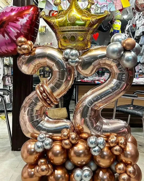 A stylish rose gold and silver balloon bouquet for a 22nd birthday. This is a great option for a gift or a smaller celebration.