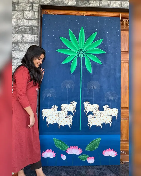 My largest Pichwai canvas to date, standing tall and ready to be shipped to a client. This piece features the traditional elements of cows, a stylized palm tree, and lotuses under a starry night sky.
