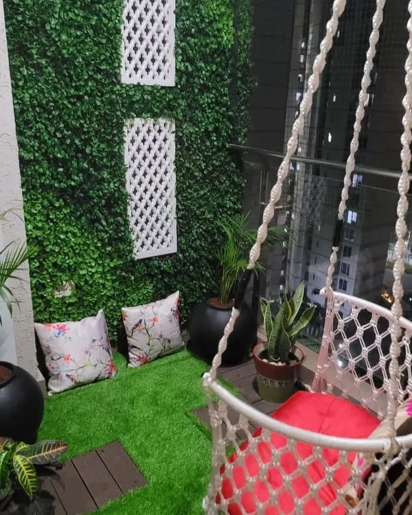 I designed this balcony as a special place for a small child. With a fun macrame swing, soft artificial grass to sit on, and some pebbles to play with, it has become her favorite spot to swing, play, and even have her meals.